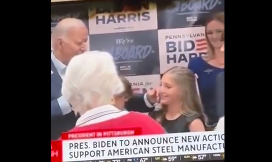 Biden caught creeping up on little girl, rubbing her cheek